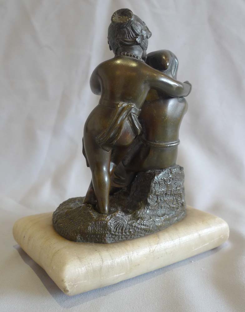 Antique French patinated bronze group of two children on white marble cushion base, mid 19th century