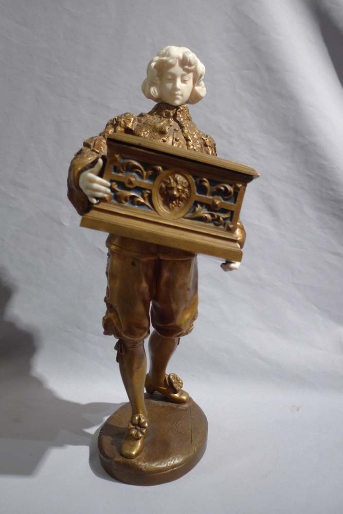 Ormolu and ivory figure of page holding casket with watercolour on ivory signed Rene Marquet.