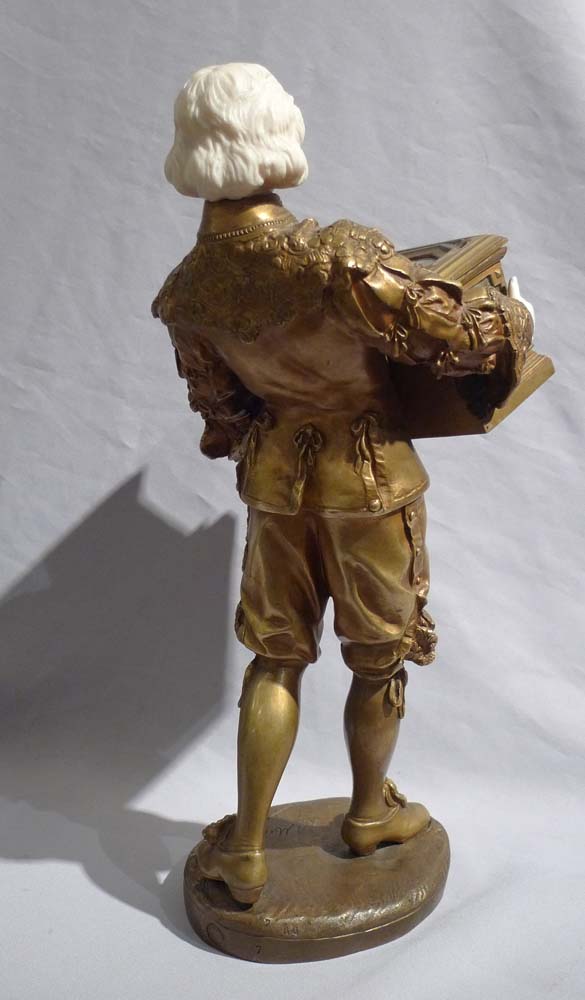 Ormolu and ivory figure of page holding casket with watercolour on ivory signed Rene Marquet.