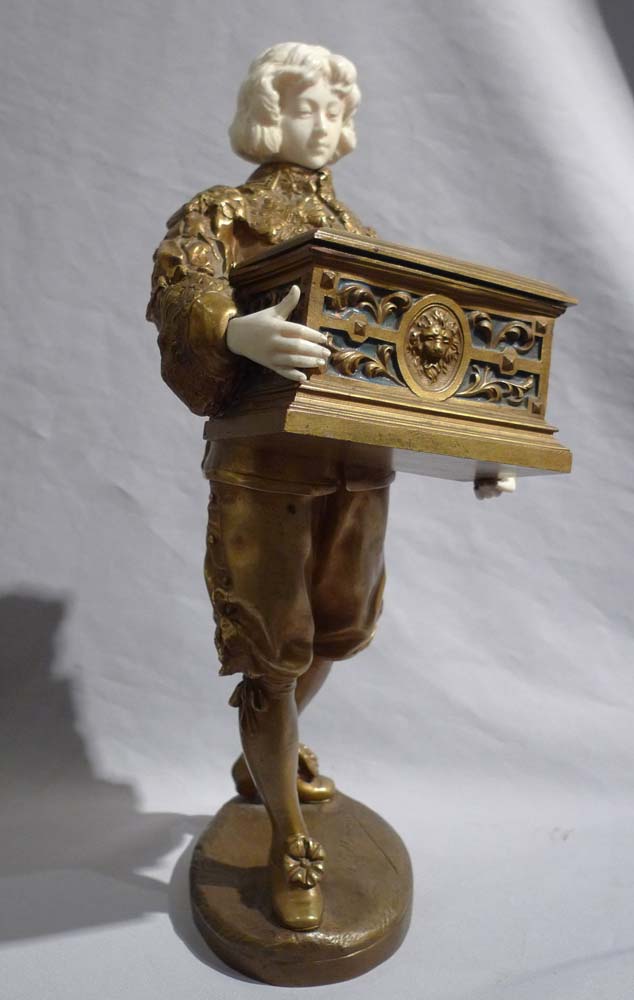 Ormolu and ivory figure of page holding casket with watercolour on ivory signed Rene Marquet.