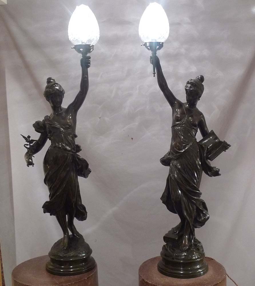 Antique pair of figural bronze lamps of classical semi draped maidens..