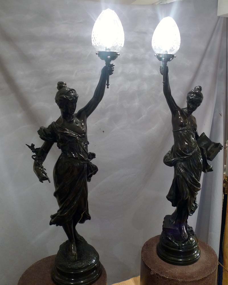 Antique pair of figural bronze lamps of classical semi draped maidens..