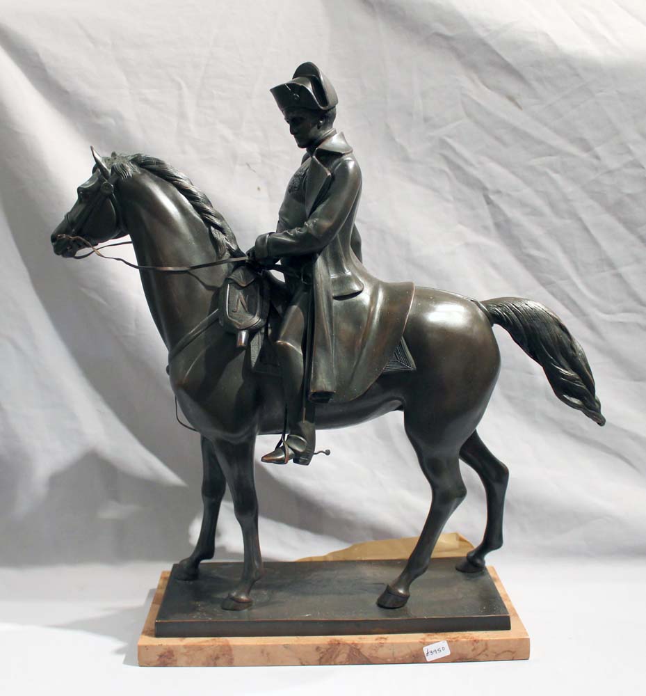 Antique bronze of Napoleon on Horseback set on a Sienna marble base..