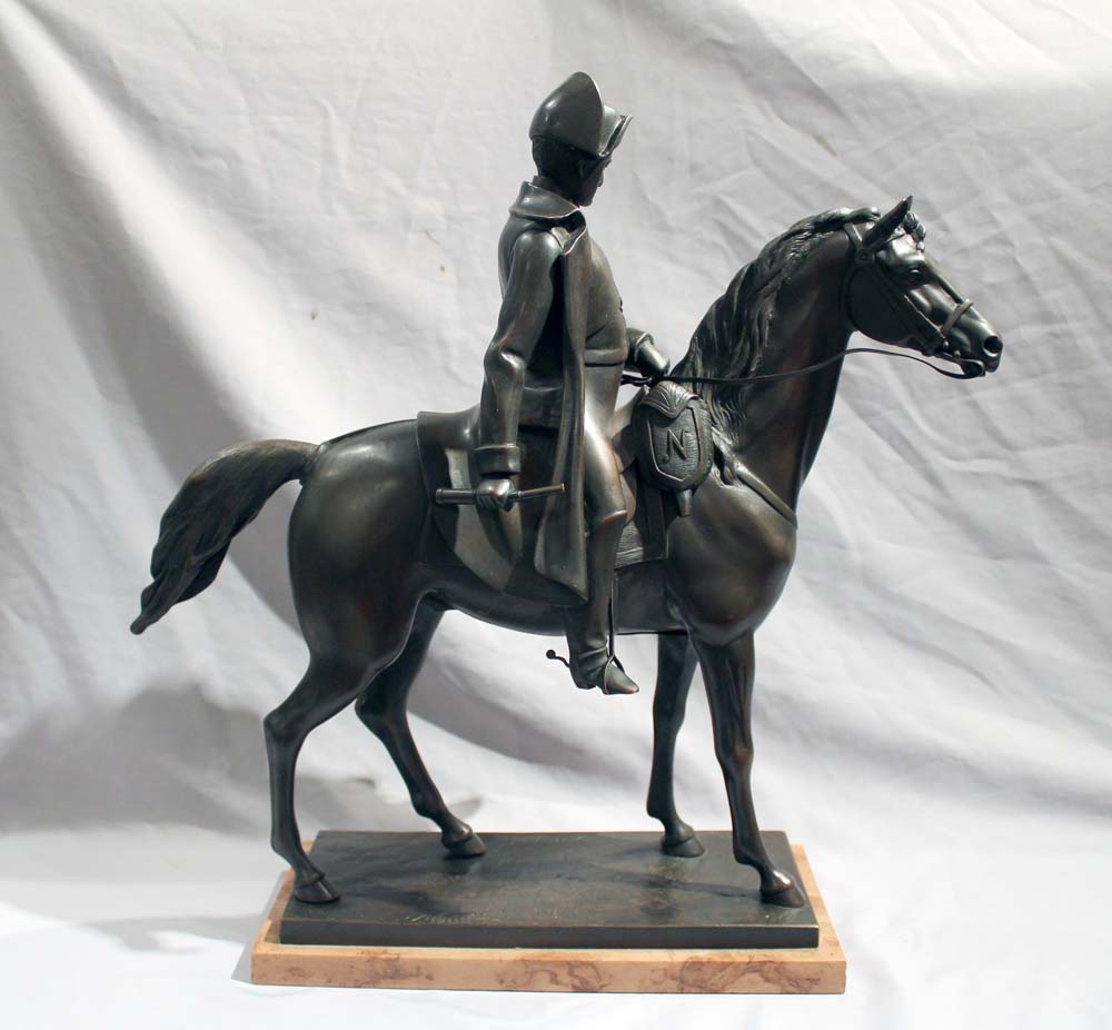 Antique bronze of Napoleon on Horseback set on a Sienna marble base..