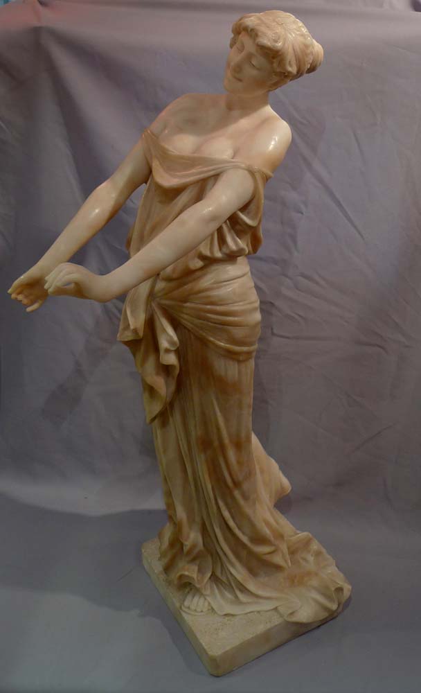 Art Nouveau alabaster figure of a maiden with her dress slipping.