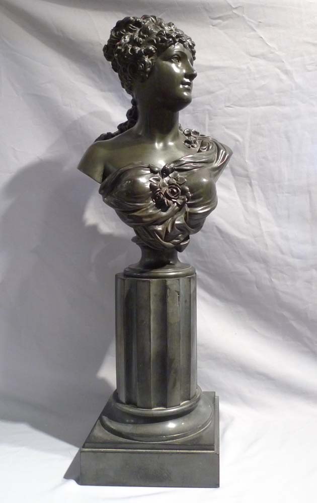 Antique French bronze bust of a classical maiden on reeded marble base.
