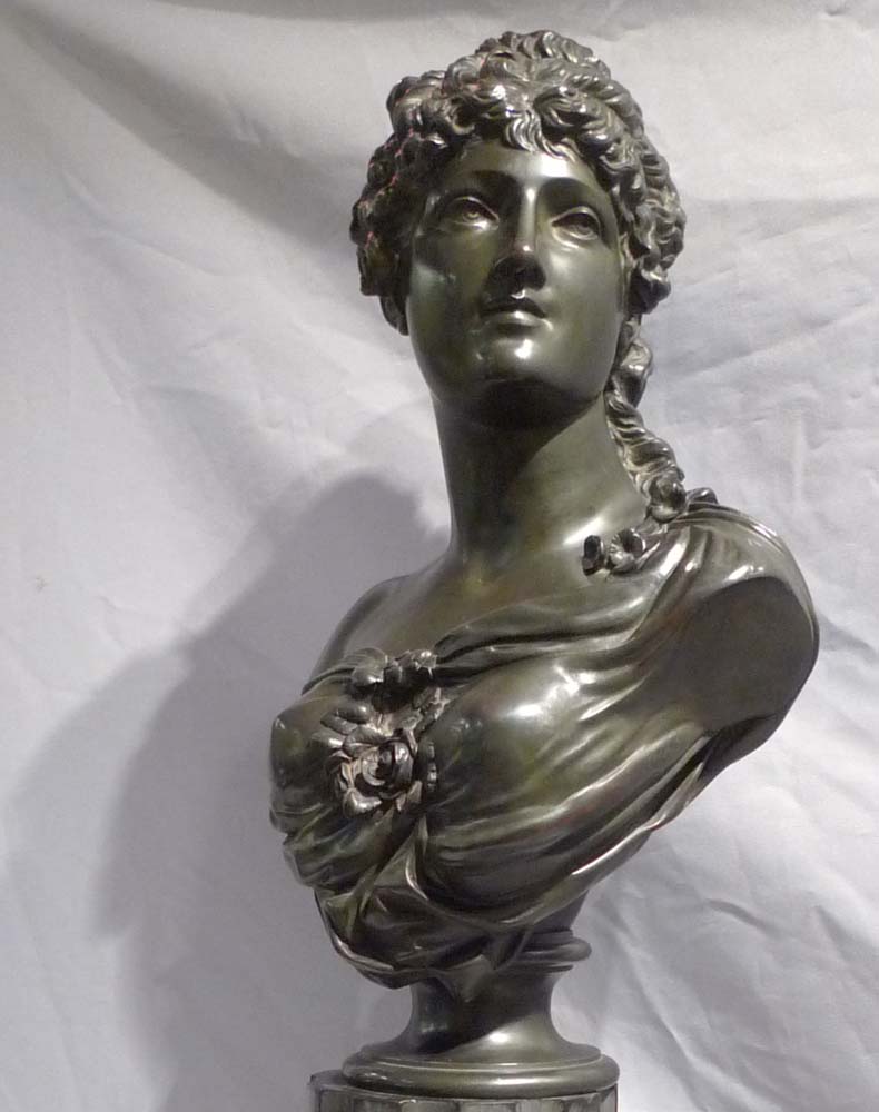 Antique French bronze bust of a classical maiden on reeded marble base.