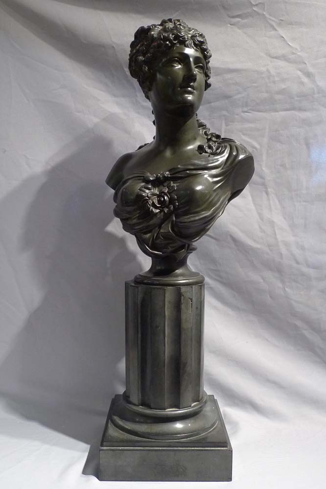 Antique French bronze bust of a classical maiden on reeded marble base.