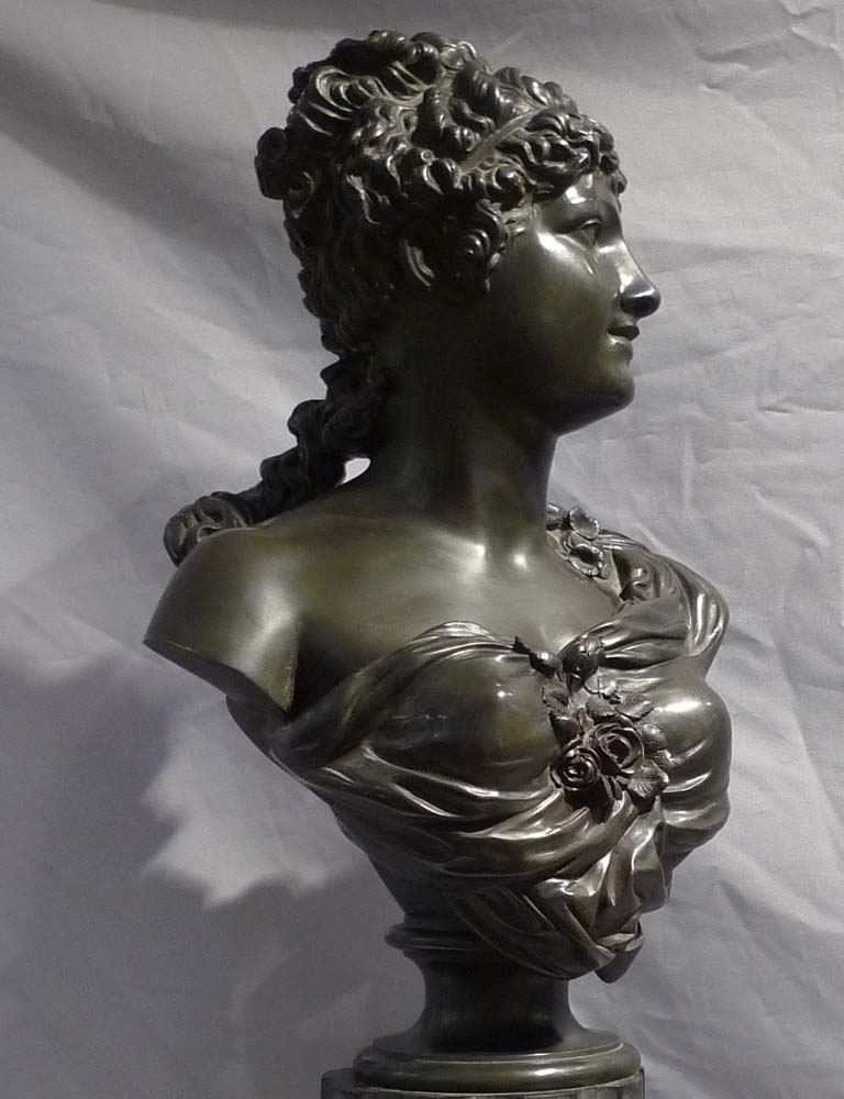 Antique French bronze bust of a classical maiden on reeded marble base.