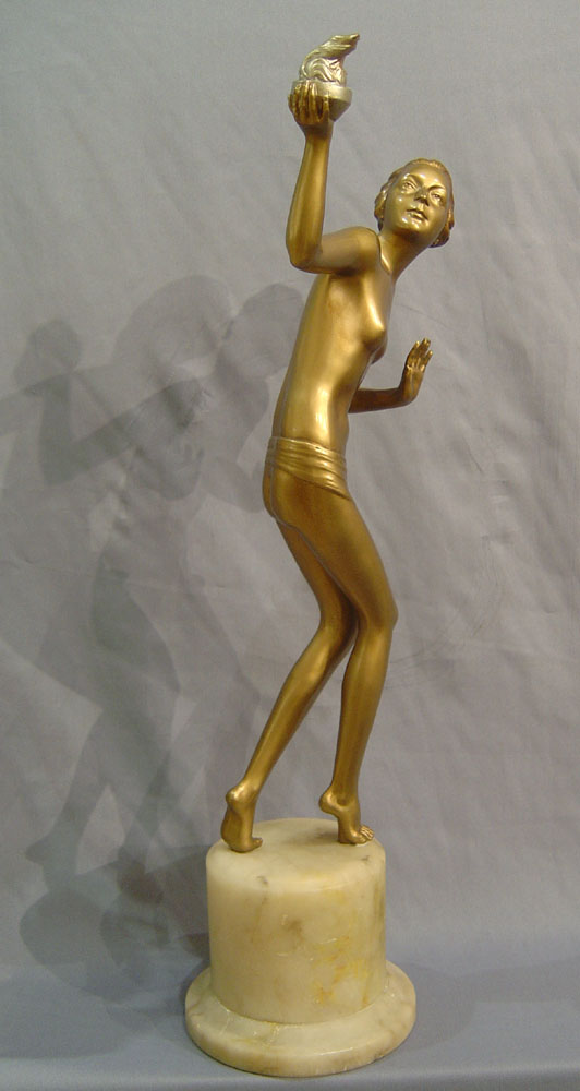 Art Deco cold painted bronze of a young woman with torch.