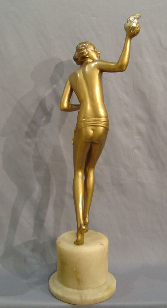 Art Deco cold painted bronze of a young woman with torch.