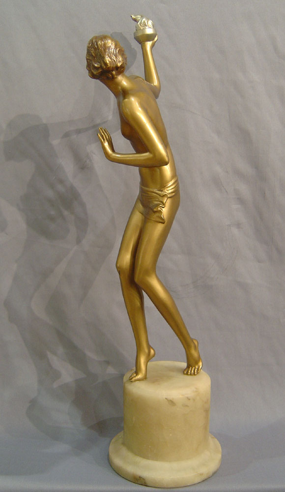 Art Deco cold painted bronze of a young woman with torch.