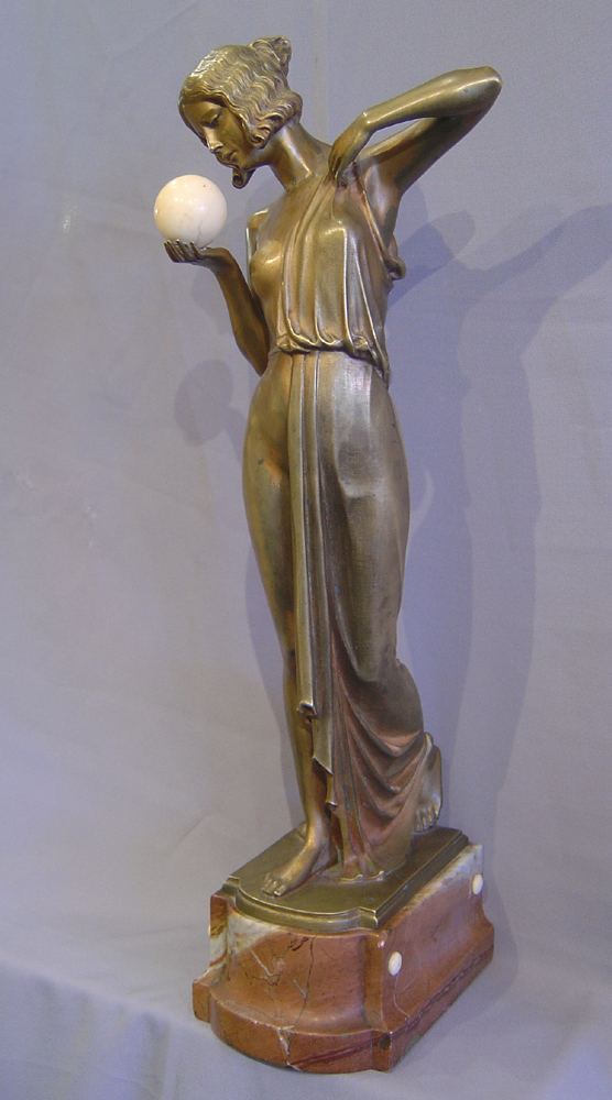 Art Deco bronze of a woman with ivory ball.