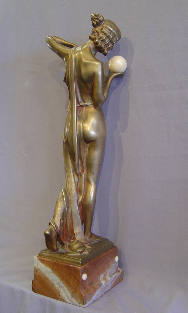 Art Deco bronze of a woman with ivory ball.