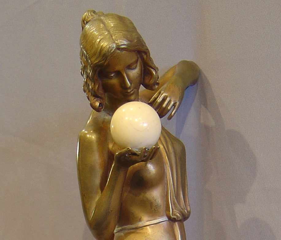 Art Deco bronze of a woman with ivory ball.
