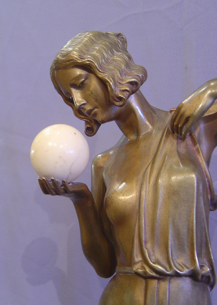 Art Deco bronze of a woman with ivory ball.