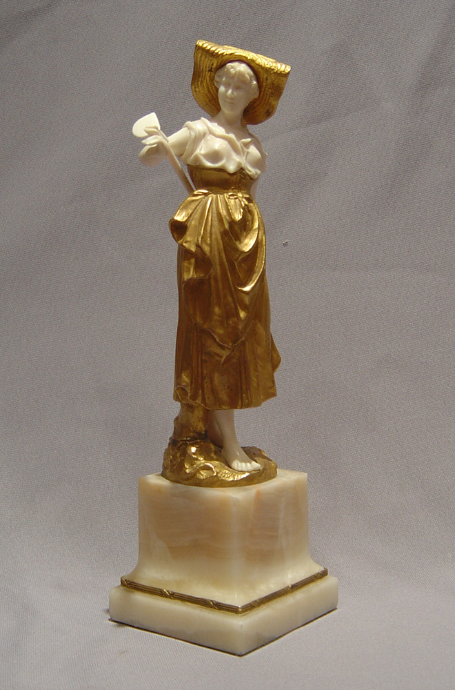 Art Deco bronze and ivory figure of a gardener.