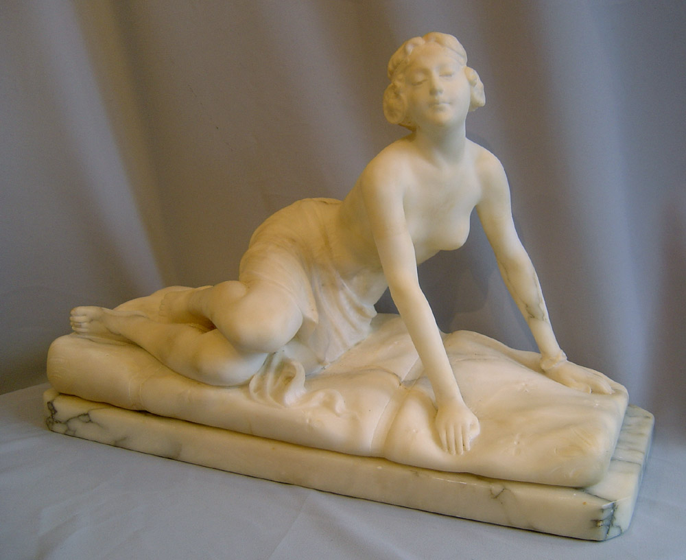 Art Deco marble figure of reclining female.