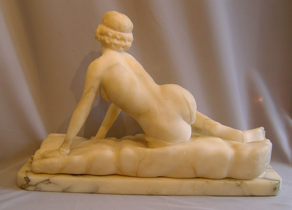 Art Deco marble figure of reclining female.