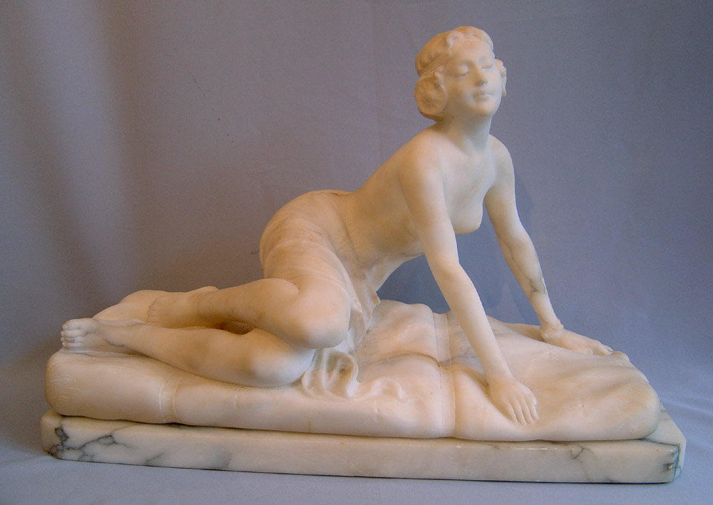 Art Deco marble figure of reclining female.