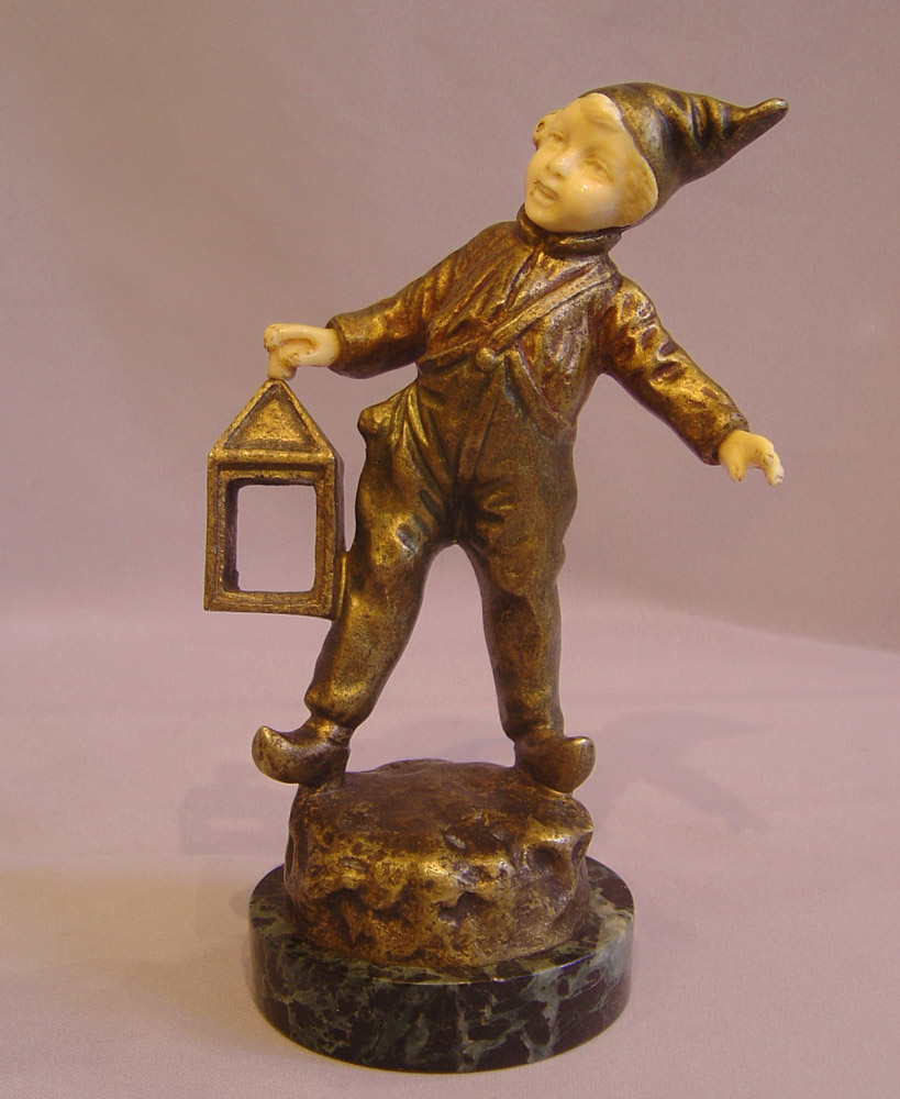 Art Deco Bronze and ivory of boy with lantern.