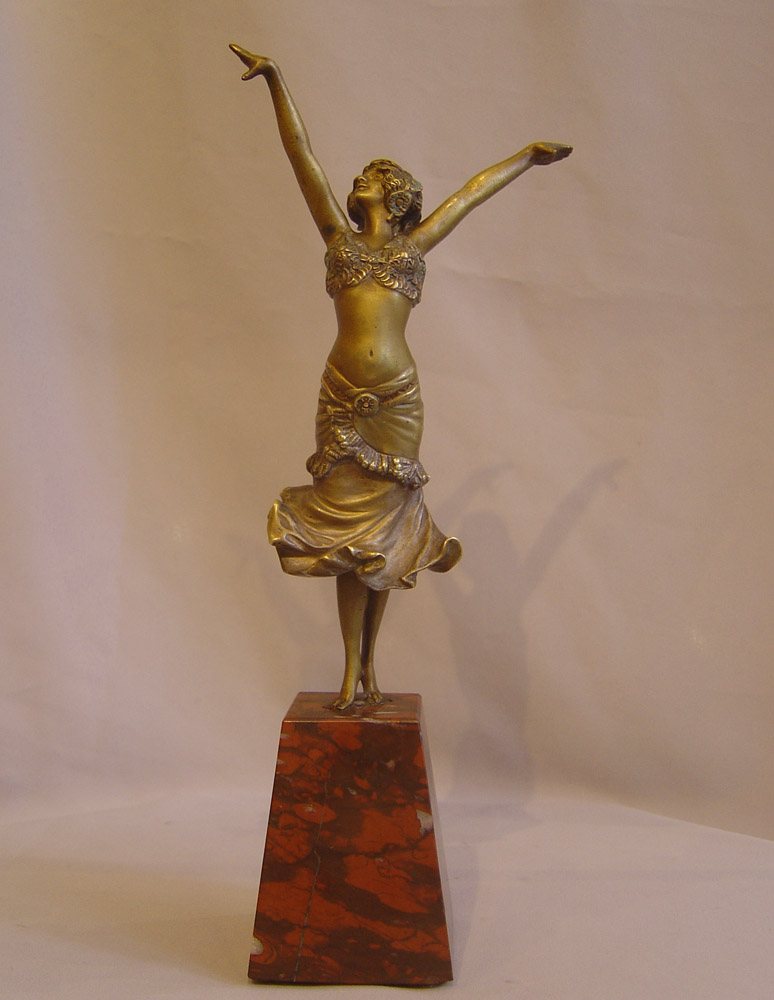 Art Deco Paul Philippe bronze figure on rouge marble base.