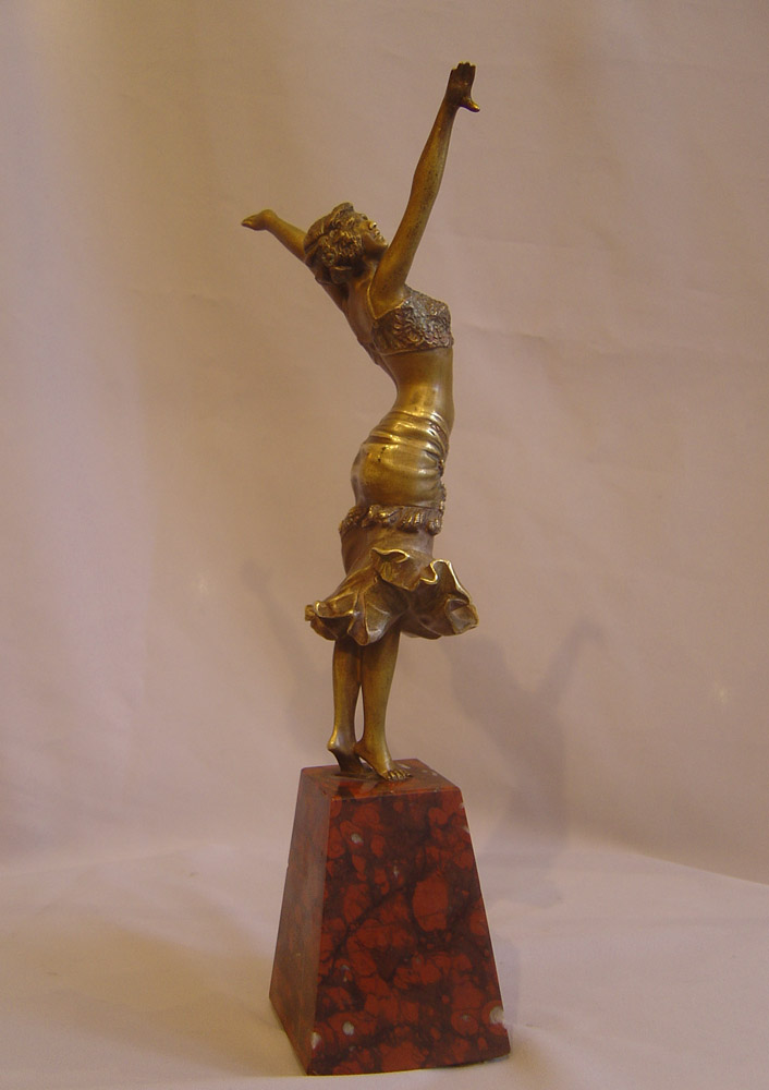 Art Deco Paul Philippe bronze figure on rouge marble base.