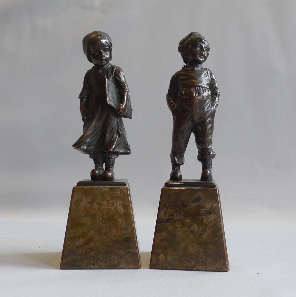 Art Deco pair of bronze girl and boy on marble bases.