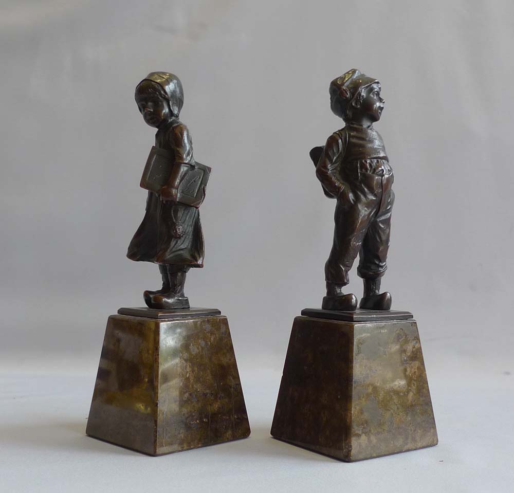 Art Deco pair of bronze girl and boy on marble bases.