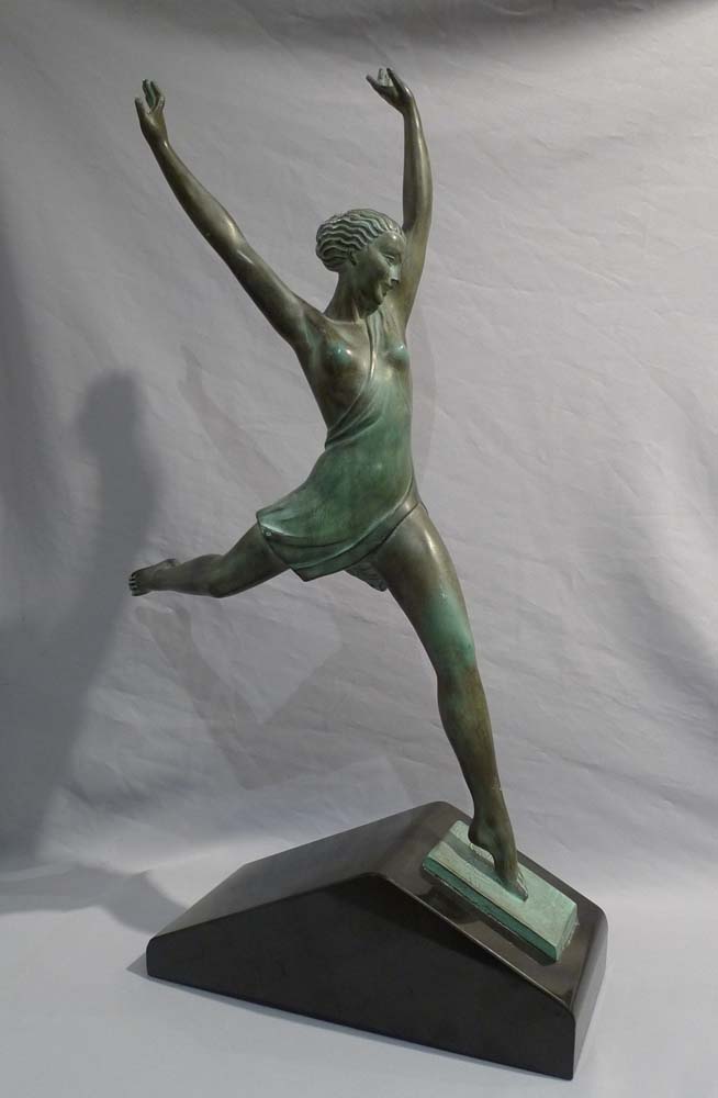 Art Deco green patinated bronze  of a dancer on a marble base.