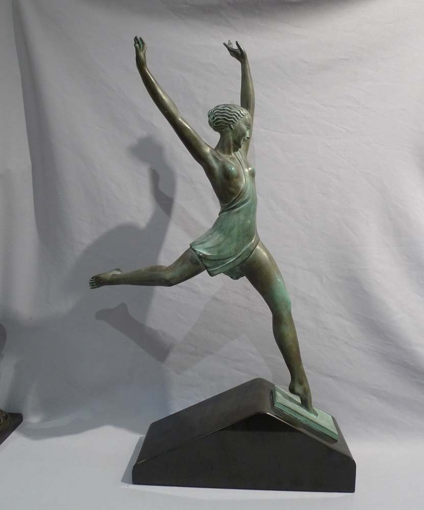 Art Deco green patinated bronze  of a dancer on a marble base.