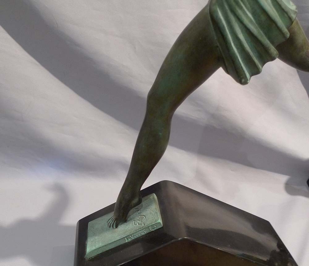 Art Deco green patinated bronze  of a dancer on a marble base.