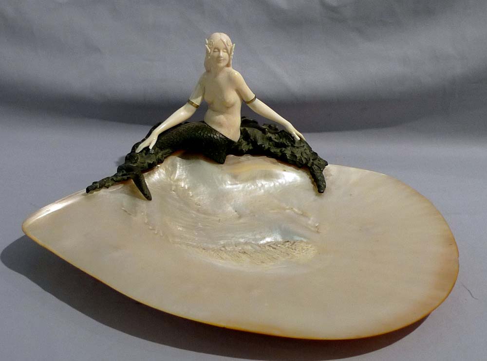 Art Deco bronze and ivory figure of a mermaid on a mother of pearl shell.