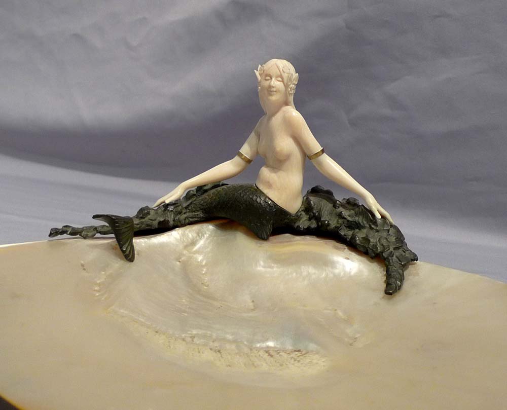 Art Deco bronze and ivory figure of a mermaid on a mother of pearl shell.