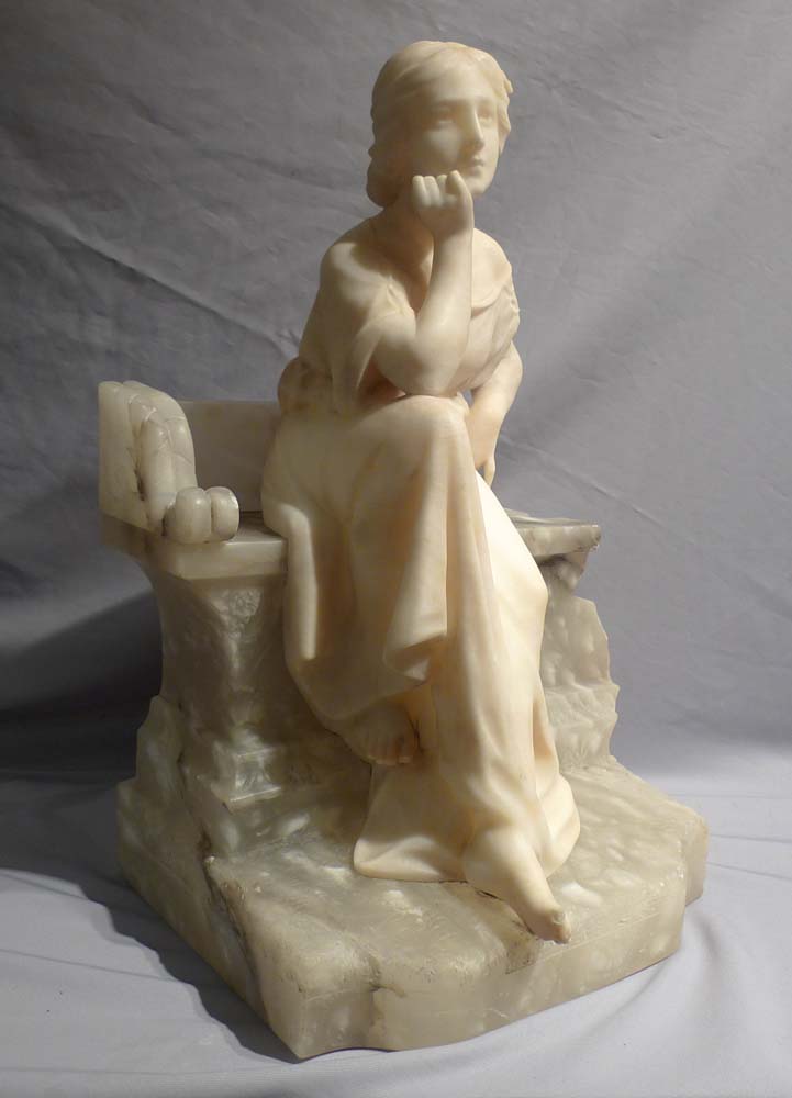 Antique Italian alabaster study of a seated girl.