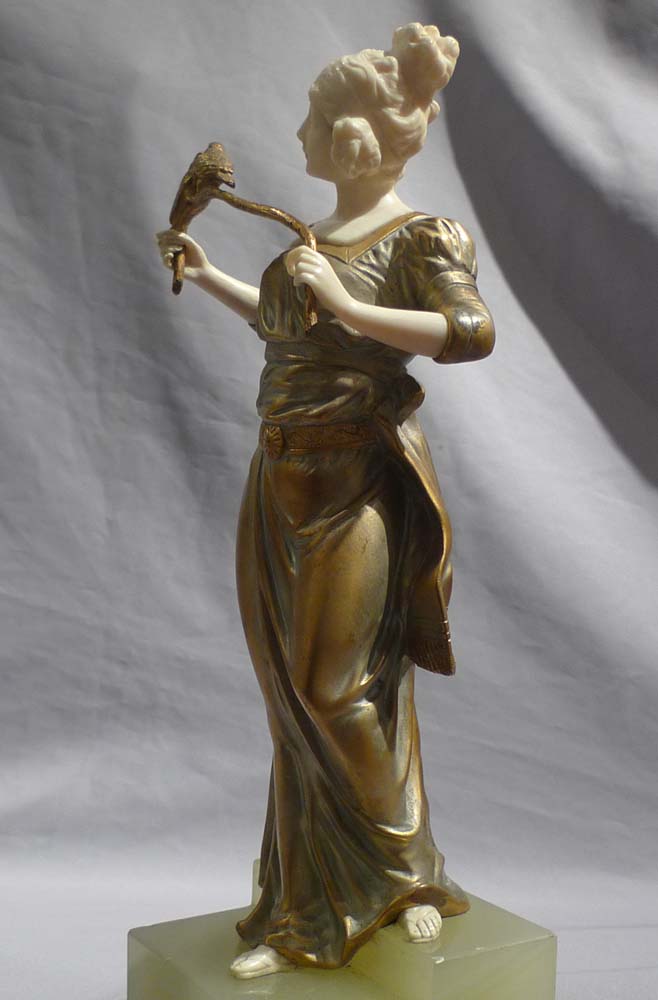 Art deco bronze and ivory by George Omerph of maiden holding a branch with birds.