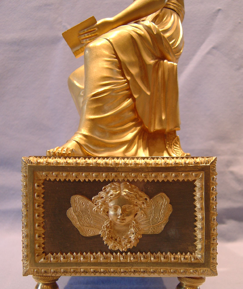 French Empire clock by Reiche of woman reading