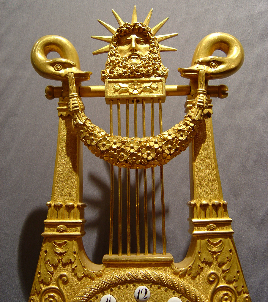 Antique French Empire marble and ormolu Apollo Lyre clock.