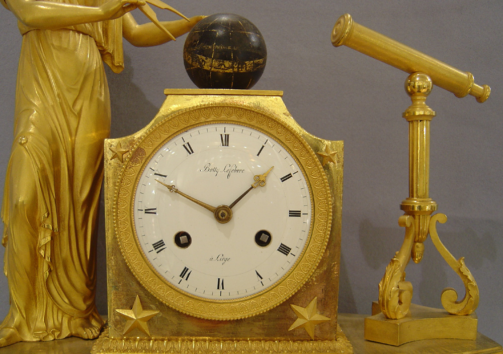 Antique French Empire ormolu mantel clock representing Astronomy.
