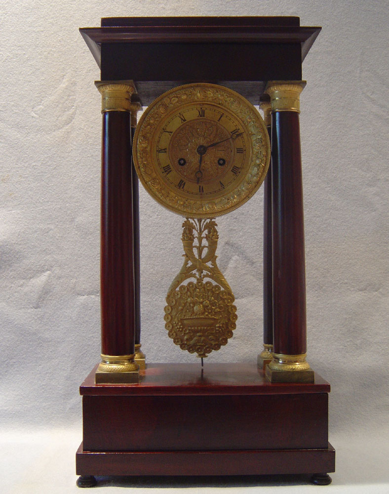 French Charles X period antique mahogany and gilt bronze mounted portico clock