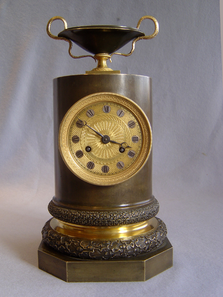 Antique French Empire clock in patinated bronze and ormolu by Claude Galle.