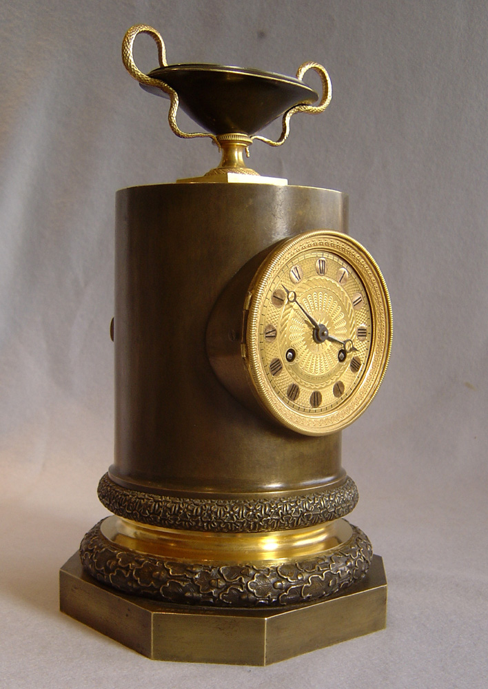 Antique French Empire clock in patinated bronze and ormolu by Claude Galle.
