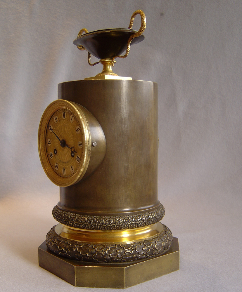 Antique French Empire clock in patinated bronze and ormolu by Claude Galle.