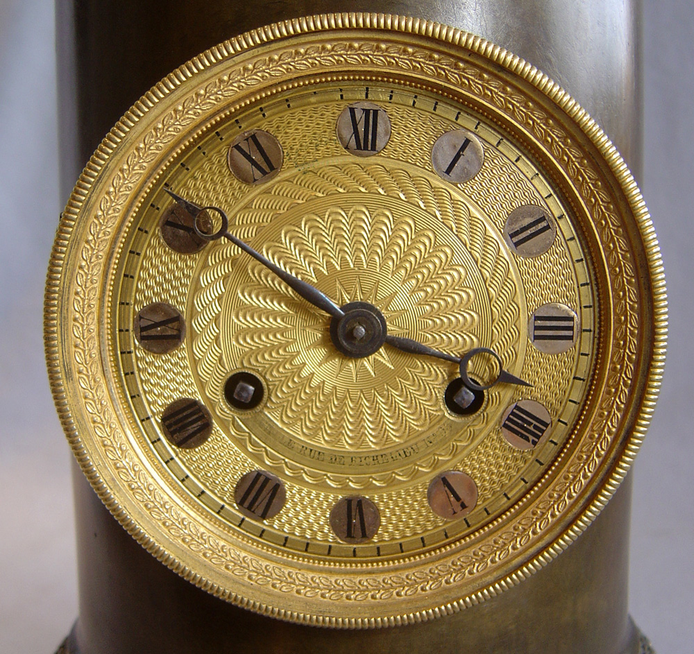 Antique French Empire clock in patinated bronze and ormolu by Claude Galle.