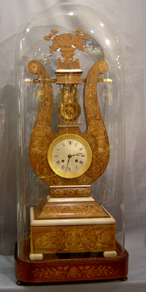 Antique French Louis Philippe Lyre clock in rosewood and marquetry under original glass dome.