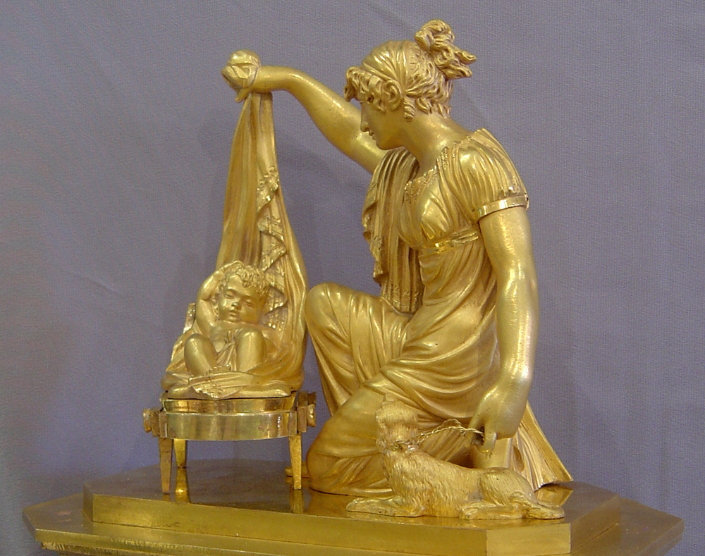 French Empire clock of Venus uncovering Cupid.