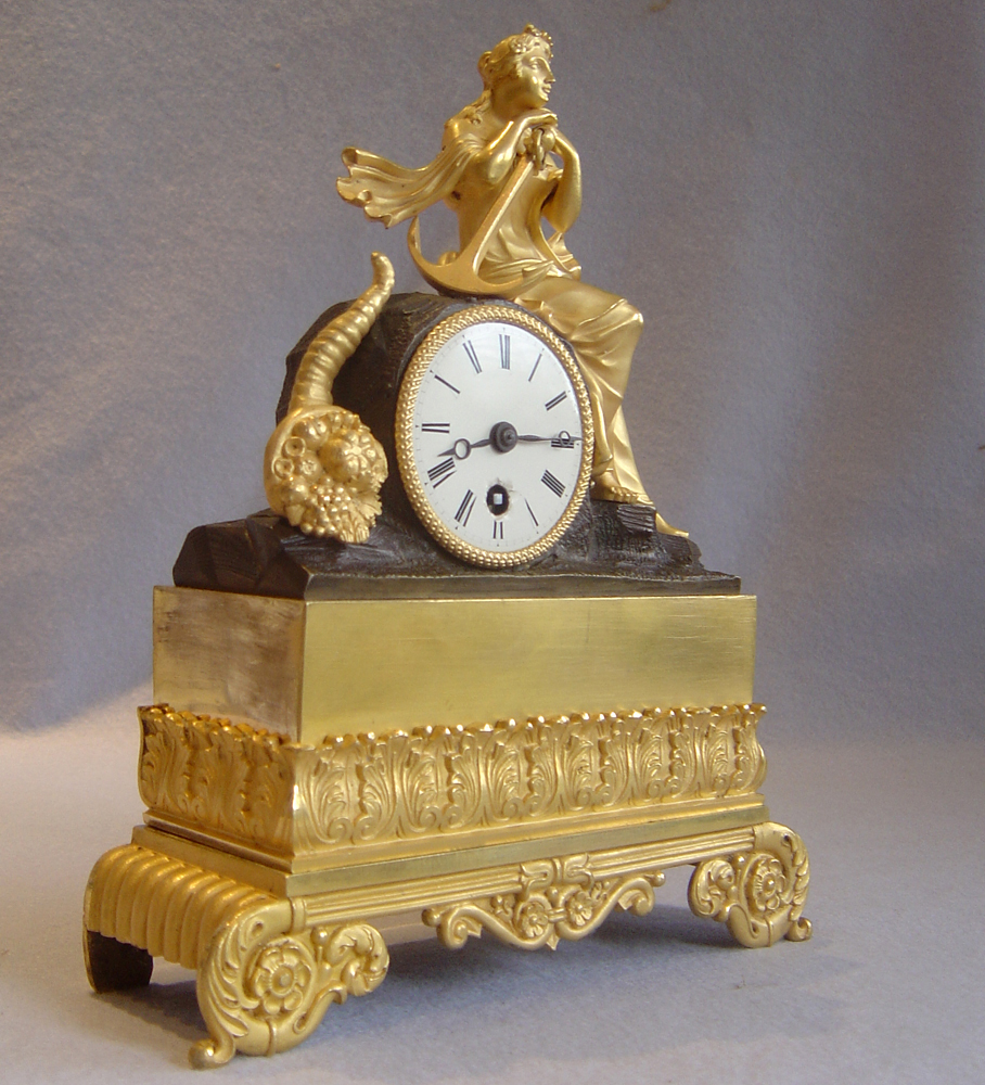 Antique Clock, French Charles X period in ormolu and patinated bronze of Hope, signed Leroy a Paris.
