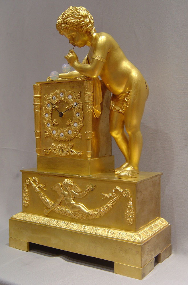 French antique clock of the Bubble blower after Thomire