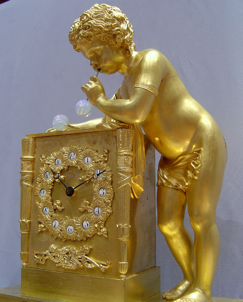 French antique clock of the Bubble blower after Thomire