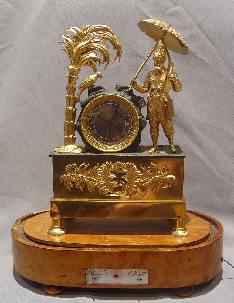 Antique French Robinson Crusoe mantel clock with musical base.